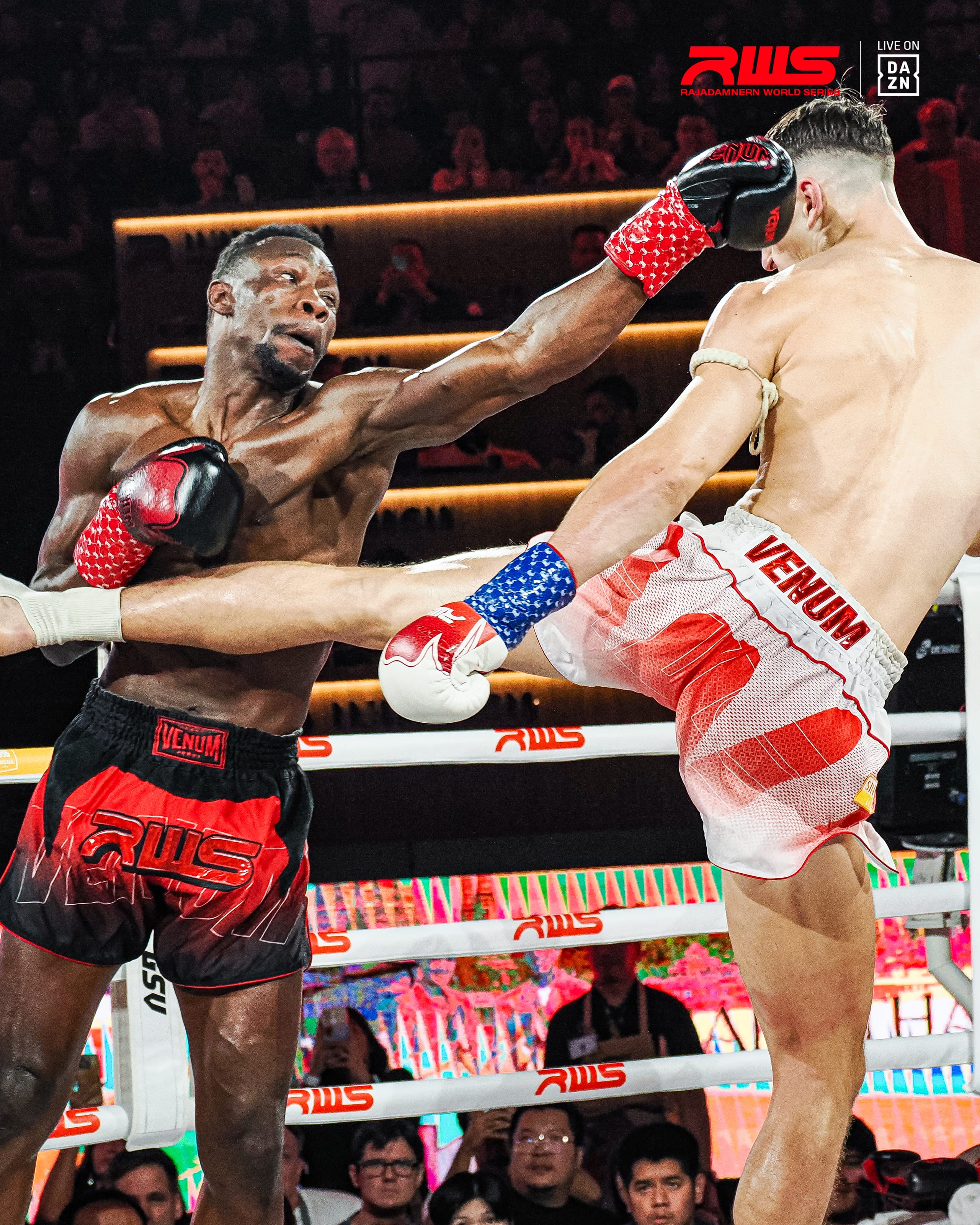 Louie Doherty driving a right body kick into his opponent in the corner