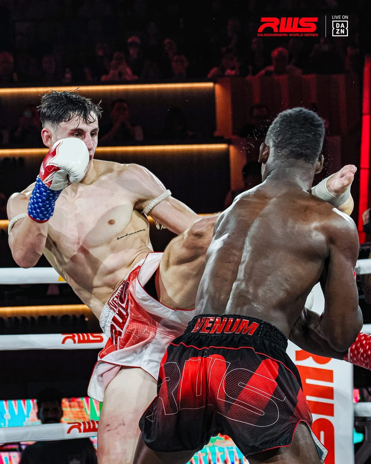 Louie Doherty driving a knee upward through his opponent guard