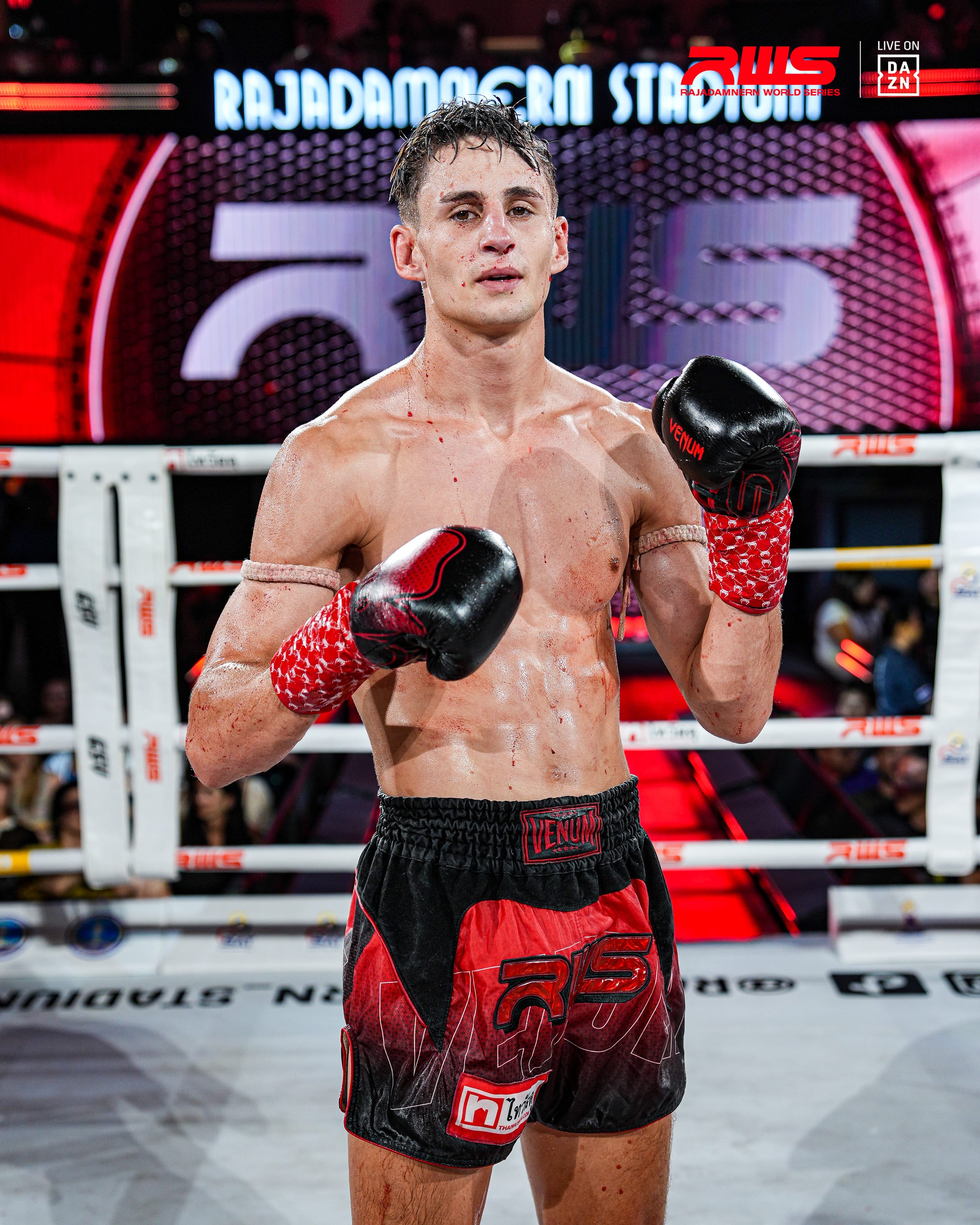 Louie Doherty with his guard up inside the ring under stadium lights