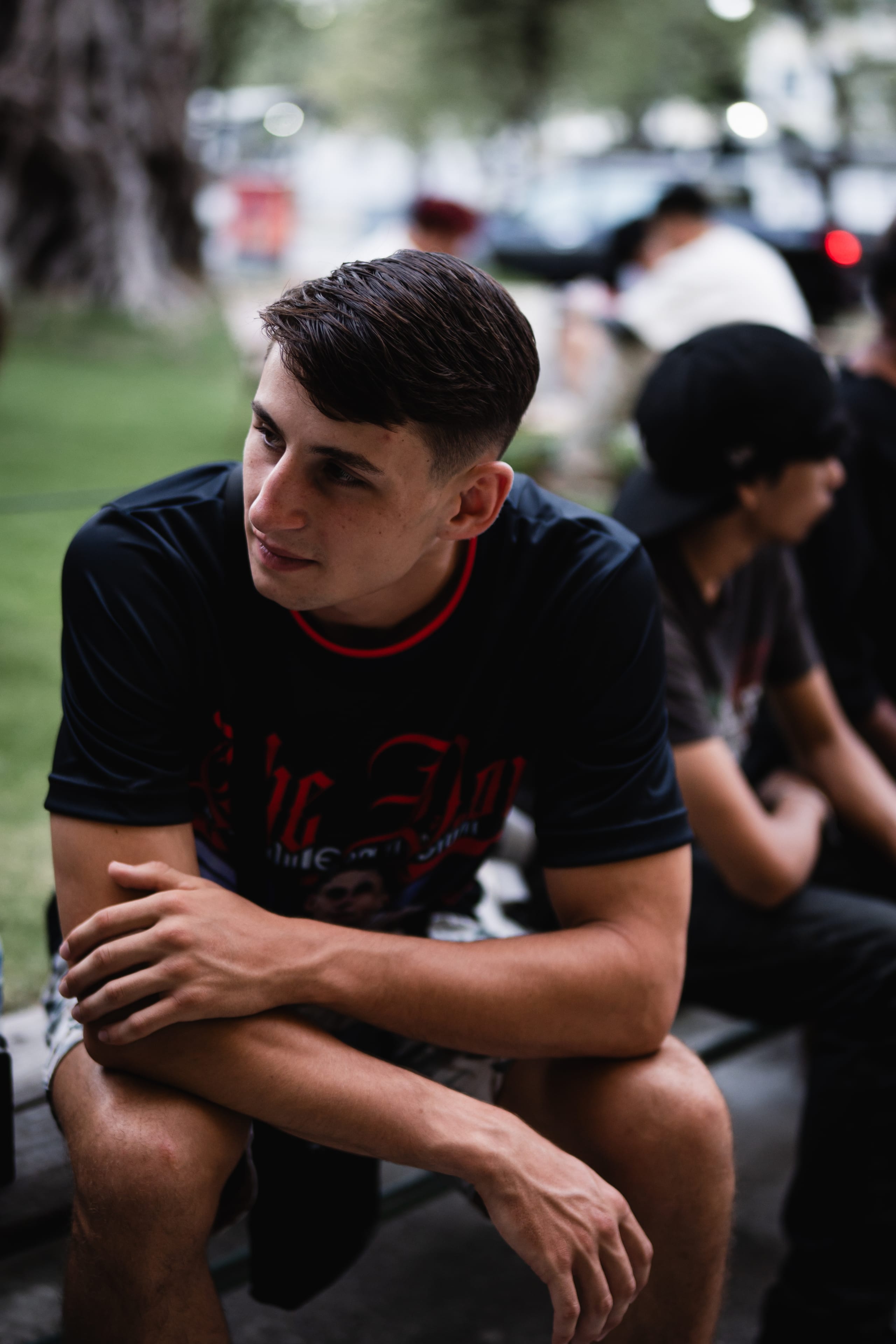 Louie Doherty sitting outdoors in a black Team Doherty shirt