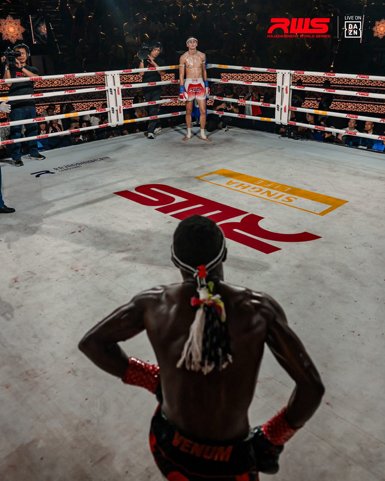 Wide stadium view of Louie Doherty circling his opponent