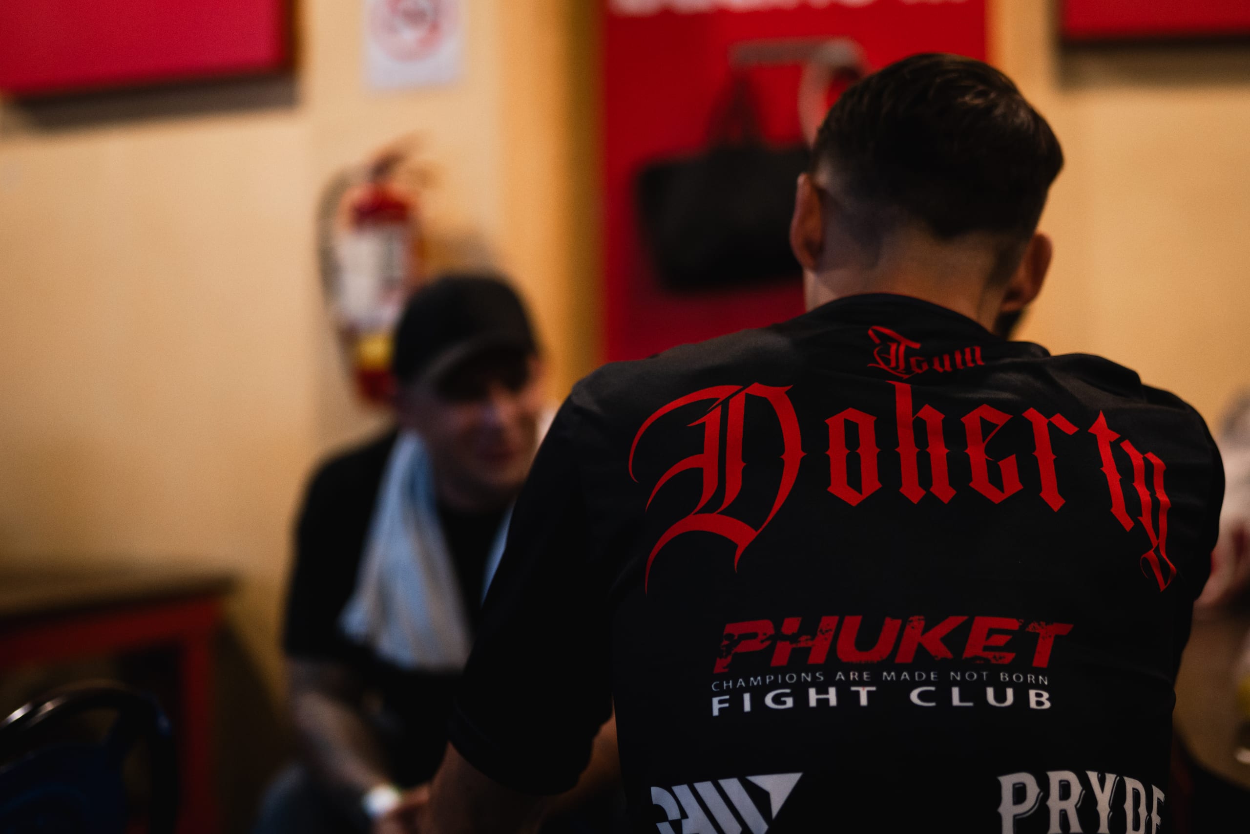 The back of a Team Doherty shirt reading Phuket Fight Club, champions are made not born