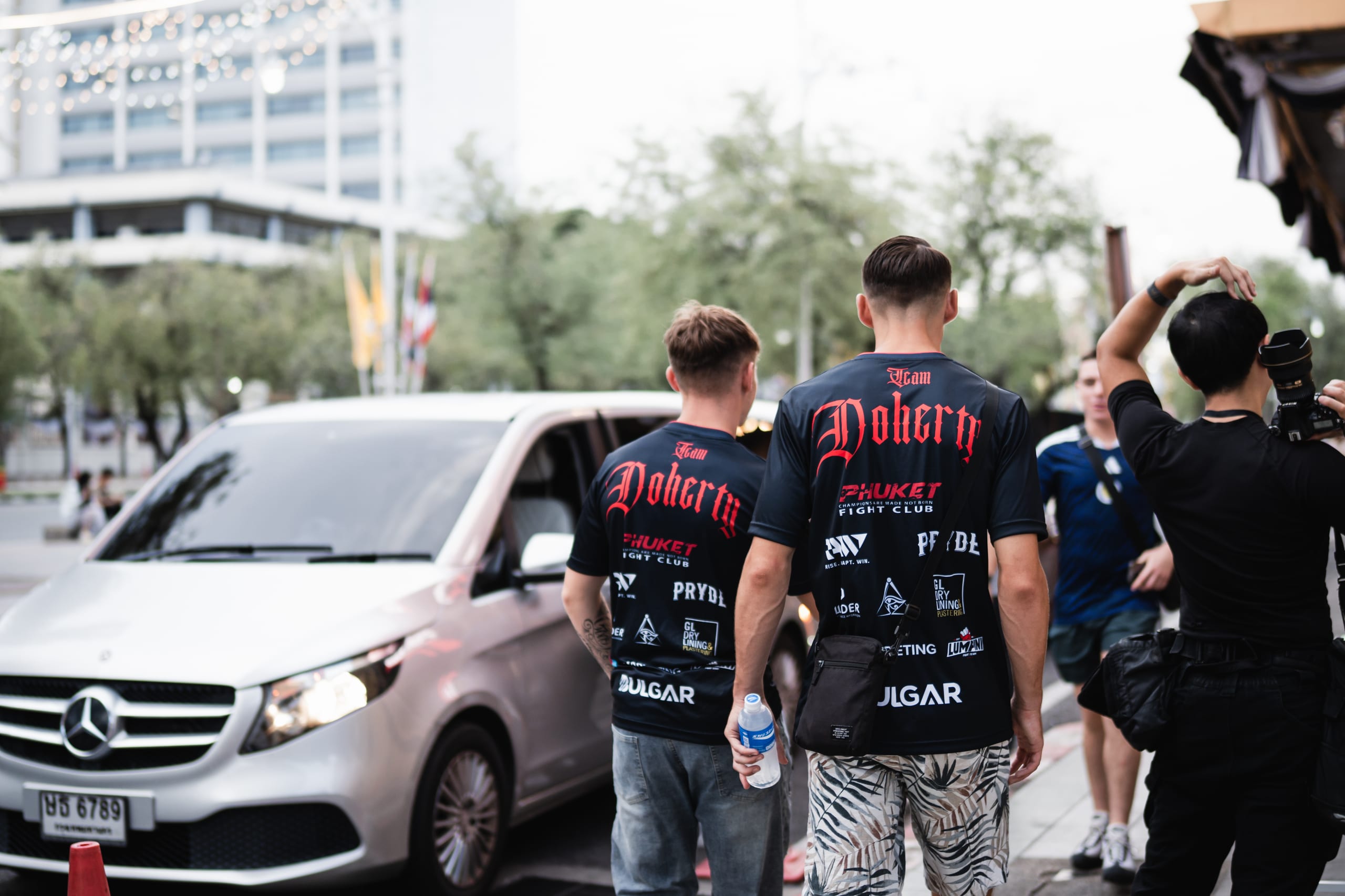 Team Doherty walking together in sponsor-branded shirts